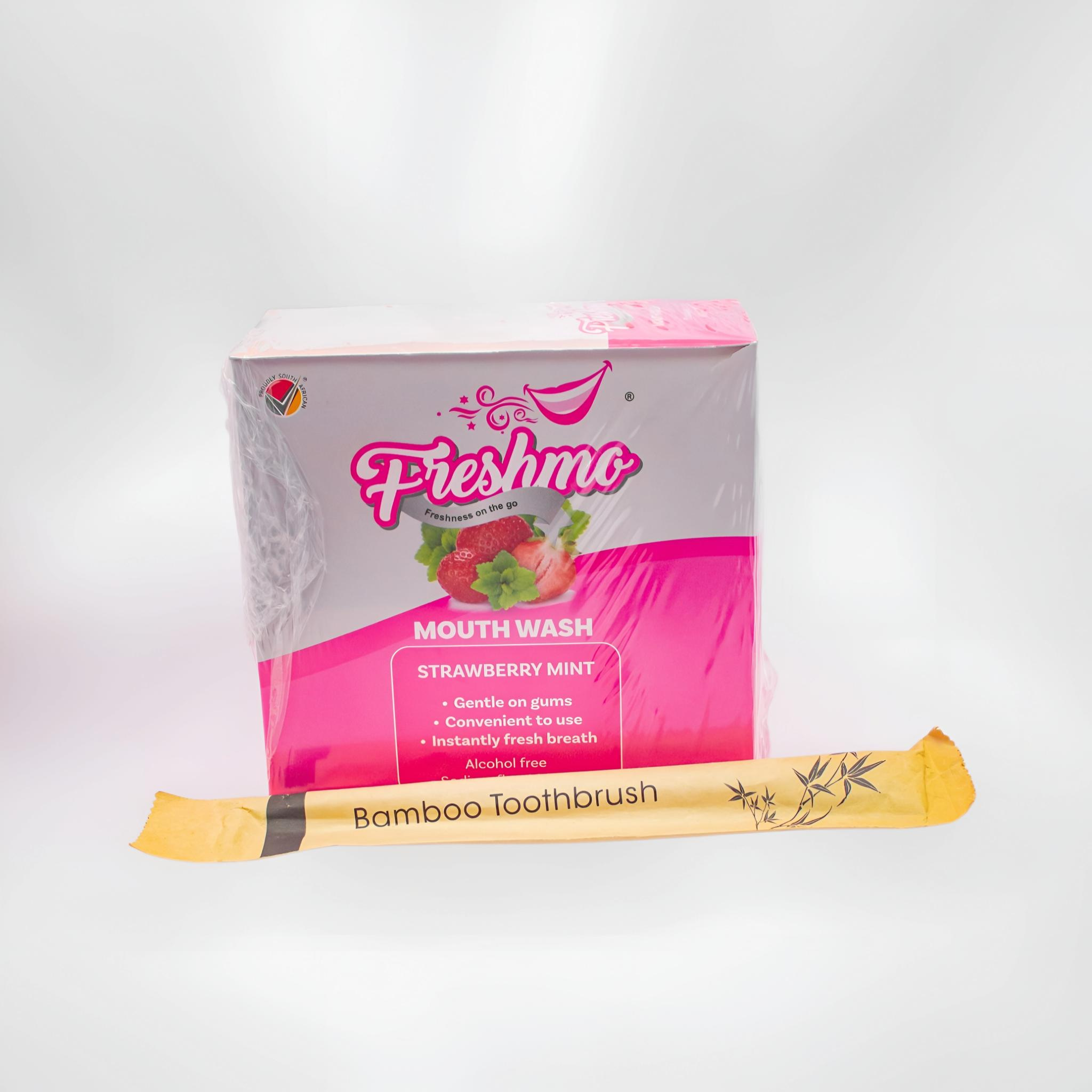 Freshmo Strawberry Mint mouthwash retail box bundled with a bamboo toothbrush